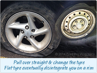 Pull over straight & change the tyre Flat tyre eventually disintegrate you on a rim